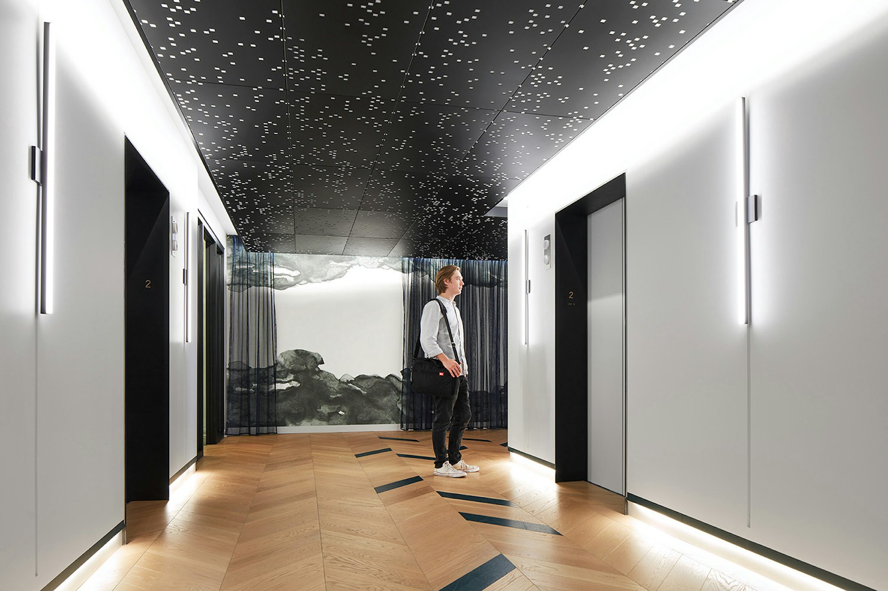 Elevator lobby with custom celling light instillation